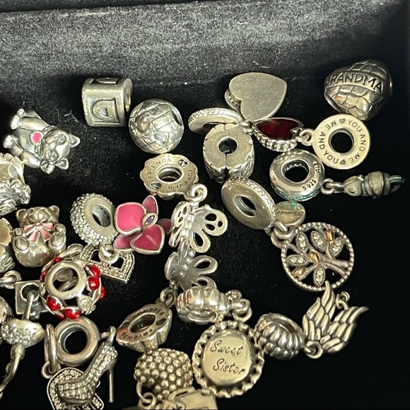 Lot of 26 Authentic Pandora charms.